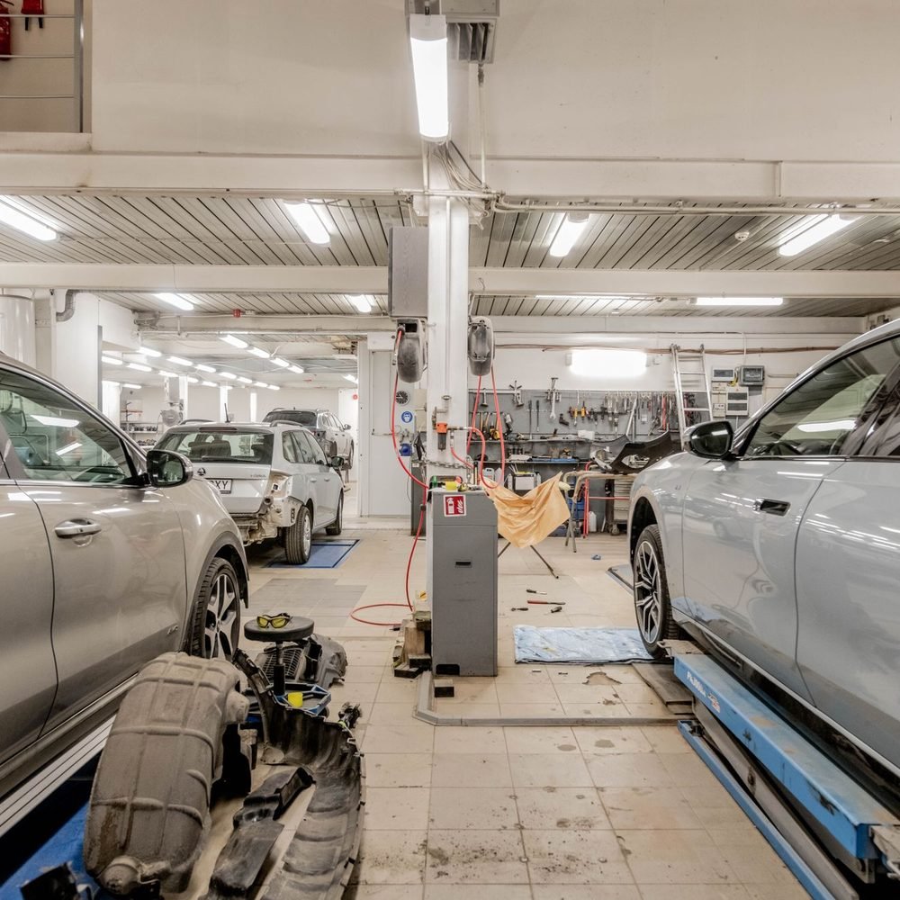 Vehicles under repair on the AD Auto Collision shop floor